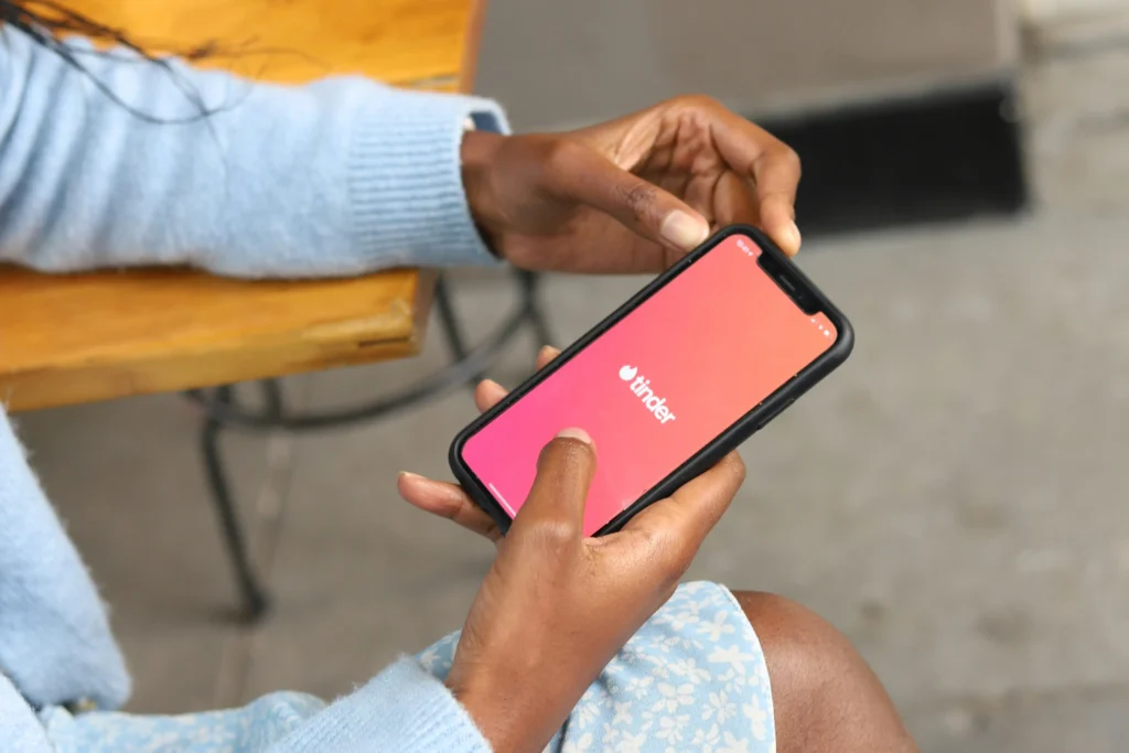 A woman with tinder open on her phone